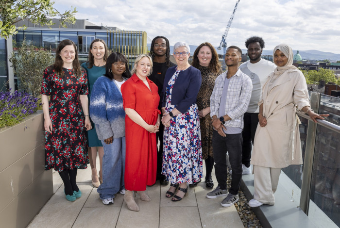 Staff and clients at a KIND event in 2025